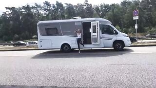 Public sex on the A1 motorway in wet look leggings, getting soaked completely