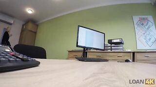 The woman needs a loan for business, she is interviewed by the agent