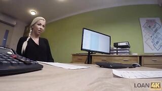 The woman needs a loan for business, she is interviewed by the agent