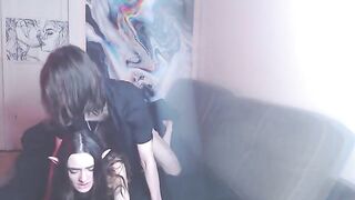 A couple enjoys a passionate cyberpunk-themed homemade session
