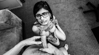 A young woman attempts to impress a man in a black and white porn audition