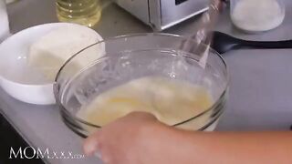 The petite stepdaughter gets a lesson from her strict stepmom in the kitchen