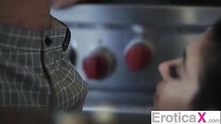 The cute couple has a passionate and sensual sex in the kitchen