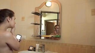 A mature woman with big boobs fucks herself early in the morning