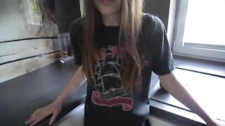 A man is having fun with his sexy step-sister in the kitchen in a steamy scene
