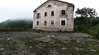 An exhibitionist girl walks through abandoned buildings with her hot GF