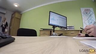 A business lady is trying to get some extra money from the bank