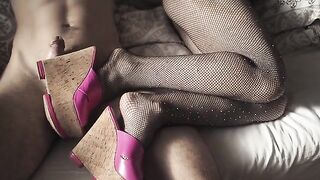 A sexy girl wearing fishnet stockings and high heels is ready for a hot session