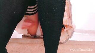 A naughty Japanese schoolgirl masturbates and squirts without panties in a daring act