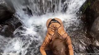 Passionate sex of risk-taking couple under the waterfall, captured in POV style