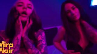 Two girls are having fun with a man using their feet