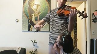 A couple was interrupted while the girl tried to practice violin