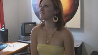 A brunette woman with big natural tits is completely naked on the bed