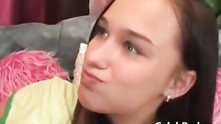 A cute teenage girl has sex with an adult man on the couch