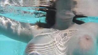 A girl fucks her favorite dildo in the pool using underwater sex toys