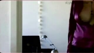 A peeping guy is watching a girl with big boobs undressing