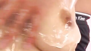 Oily handjob with Japanese brunette, showcasing her boobs and more