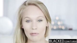 Nigerian guy fucks skinny blonde chick with small tits on the couch
