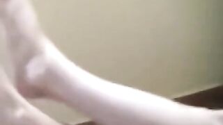 A naked girl with big natural tits is smoking