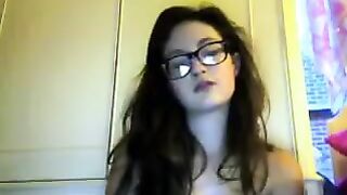 A cute student with glasses got undressed during a video chat