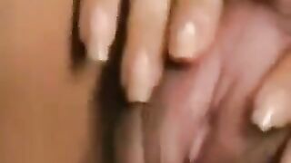 Girl with a big hairy clitoris plays with her pussy