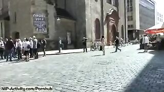 A girl has a walk with her pussy without panties in the city