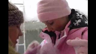 Two girls are having fun on a cold winter day in 2021