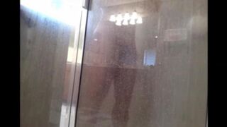 A man washes himself under a hidden camera in the shower