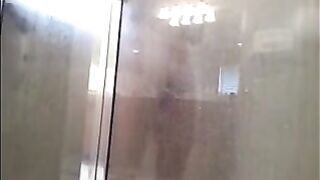A man washes himself under a hidden camera in the shower