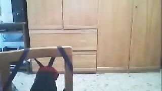 A girl is fucking in front of a webcam while her husband is nearby