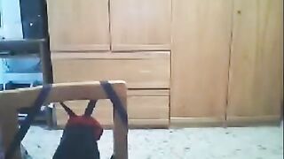 A girl is fucking in front of a webcam while her husband is nearby