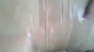 Condom on the dick, jerking off with his hand in a video