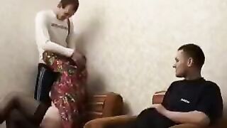 A mature woman seduces her son and his friend with her skills