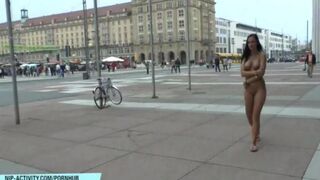 A chick went for a walk in the city without any clothes on