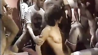 A young girl in sexy stockings is having fun with guys