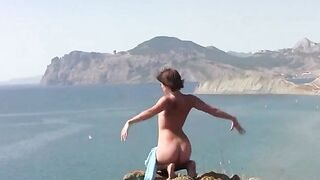 A girl posed naked on the beach, showcasing her body to attract someone