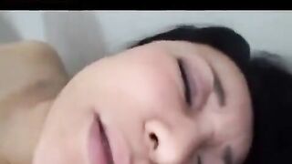 A mature Japanese man plays with his cock and fucks it in his hairy pussy