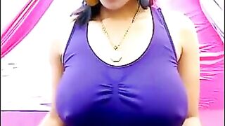 Her nipples are standing out because of her excitement, the T-shirt is wet