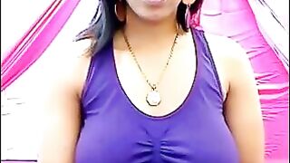 Her nipples are standing out because of her excitement, the T-shirt is wet