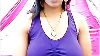 Her nipples are standing out because of her excitement, the T-shirt is wet