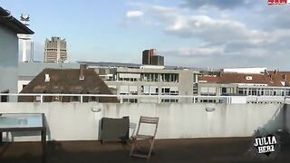 Brunette with big tits jumps on a cock on the roof in HD