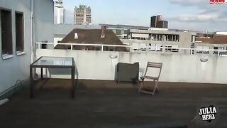 Brunette with big tits jumps on a cock on the roof in HD