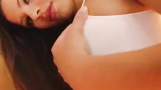 The girl caresses her big porn pussy with a dildo in close-up