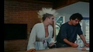 Retro porn scene with a group of girls having anal sex