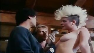 Retro porn scene with a group of girls having anal sex