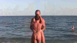 Acrobatic girls are completely naked on the beach