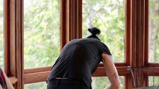 A cute Vietnamese girl was fucked in the kitchen by her girlfriend with a strapon