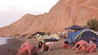 Nude beauty playing volleyball on the beach
