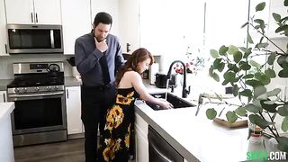 A sexy redhead is having fun in the kitchen, exploring some spicy content