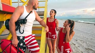 Two young lifeguards are having fun with a mature guy